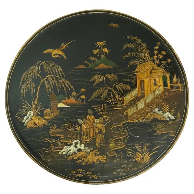Black lacquered English Chinoiserie occasional side table, early 20th Century. This highly detailed round side table...