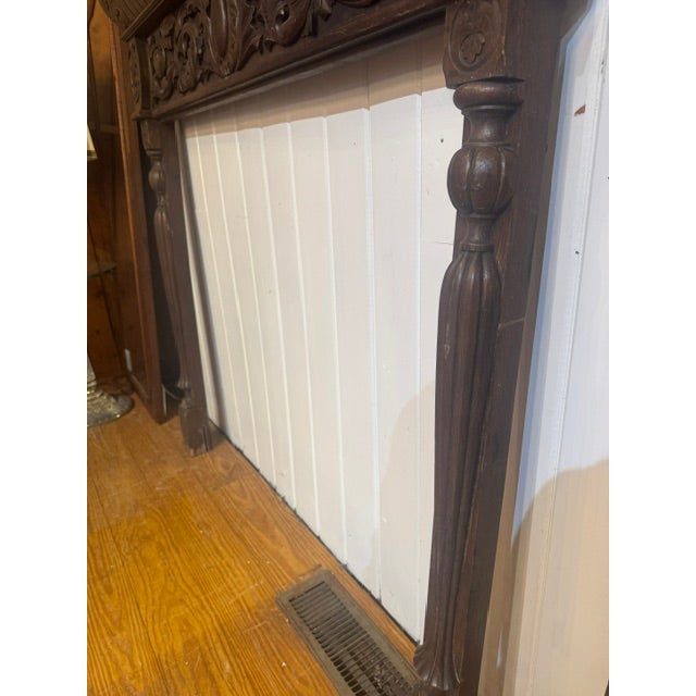 19th Century Victorian Carved Oak Fireplace Mantel. Architectural Salvage Mantel features ornate floral wood carvings and...