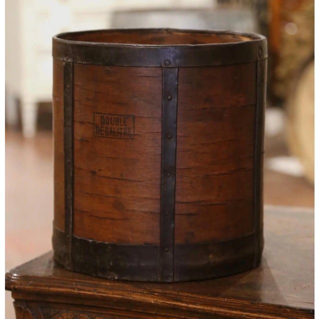 This antique grain measuring recipient was crafted in France, circa 1870. The bucket features metal straps, forged nails...