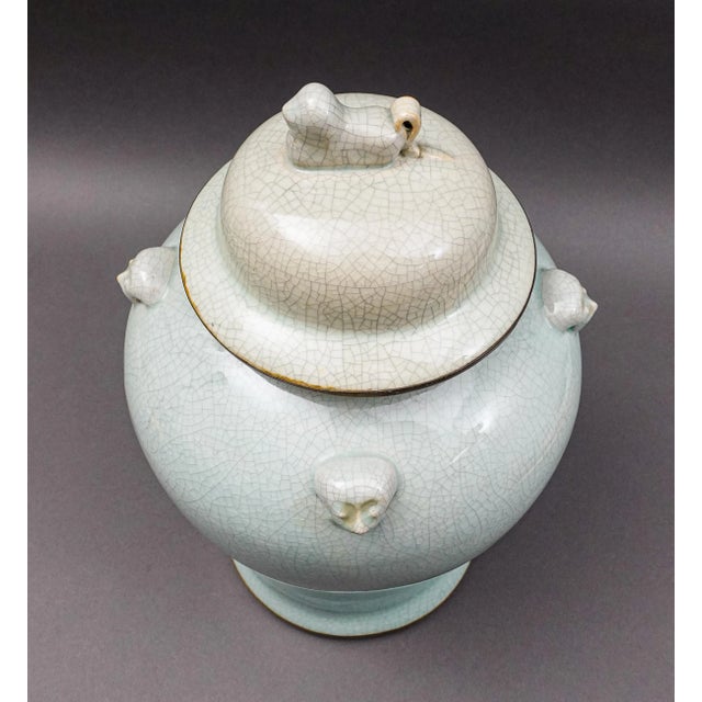 Maitland Smith Celadon Crackle Glazed Porcelain Foo Dogs Large Lidded Ginger Jar. Measures approximately 9" diameter, 12...