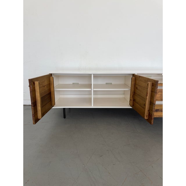 This West Elm Reclaimed Wood and Lacquer Media Console combines rustic charm with modern elegance. It offers a generous...