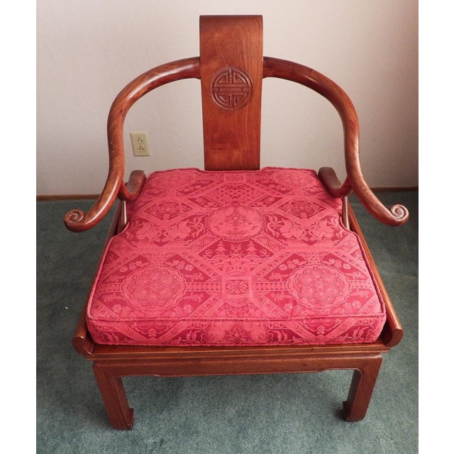 This marvelous 20th Century Chinese horseshoe chair is created in the style of George Yee in a beautiful rosewood with a...