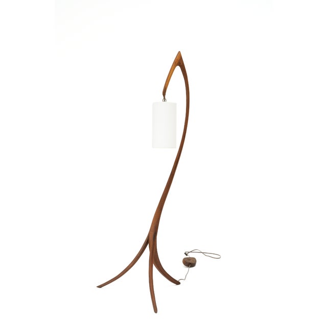 Tripod floor lamp in solid black walnut by furniture maker Michael Wilson, 21st century. Three slender, tapered walnut...