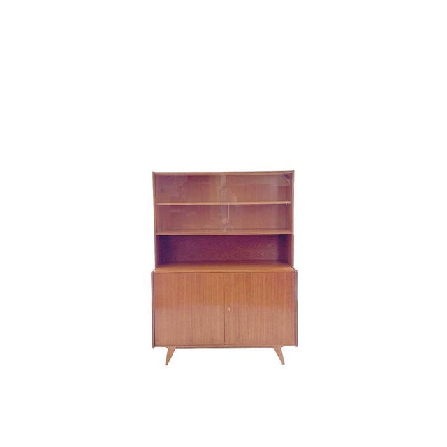 An elegant example of Eastern European modernism: this vintage U-450 cabinet with display case was designed in the 1960s...