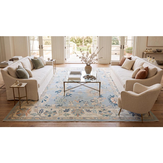 Hand-knotted with premium wool, this exquisite modern area rug reimagines classic Oushak and Khotan motifs in a soothing,...