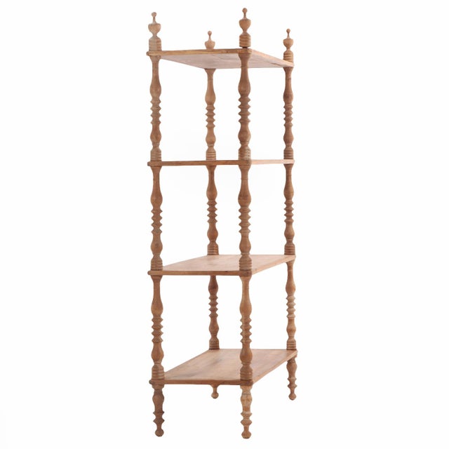 A handsome 19th-century French étagère crafted in solid walnut, featuring elegantly turned supports and four generously...