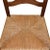 A tall wood arts and crafts style ladder back dining chair. With a square natural fiber woven seat, and a tall racked...