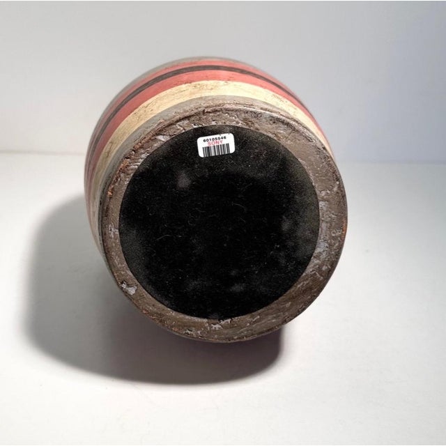 A vintage clay ceramic sculpture with fired earthy stripes on a shapely form. Acquired from the props department at Sony...