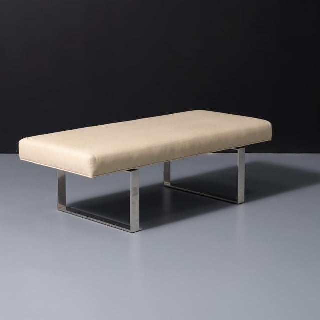 An elegant tan leather and chrome modern bench by Kravet Furniture (USA) in the style of Milo Baughman. The bench is a...