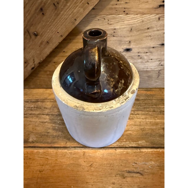 This is an antique stoneware jug, likely from the 1870’s- 1890’s. It is in great shape, but not perfect. I see no cracks,...