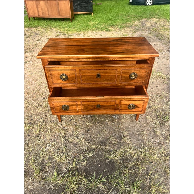 Elegant 19th-century Louis XVI style commode crafted with beautiful figured wood veneer and a warm, rich patina. This...