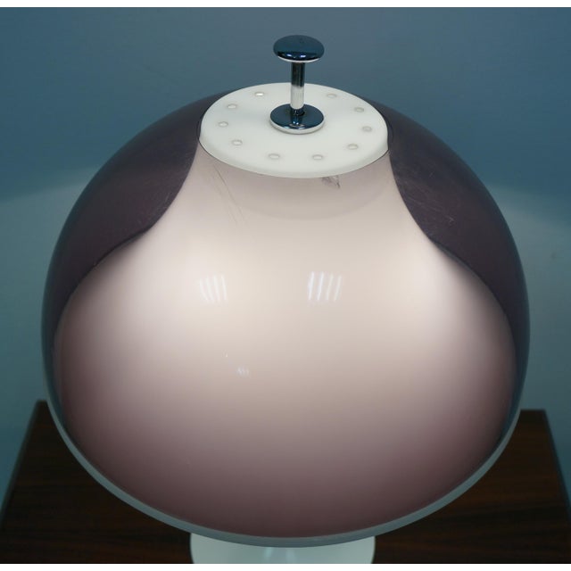 Designed by Elio Martinelli for Martinelli Luce, this table lamp is a true statement of innovation and style. with its...