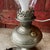 This vintage Aladdin lamp, converted to electric, combines antique charm with modern utility. Features metal construction,...