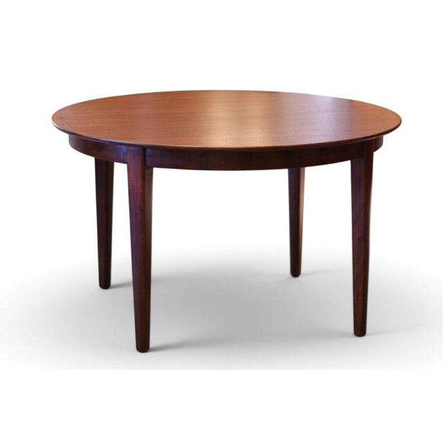 Fantastic dining table, designed by the well-known Henning Kjærnulf and manufactured by Sorø Møbelfabrik in Denmark during...