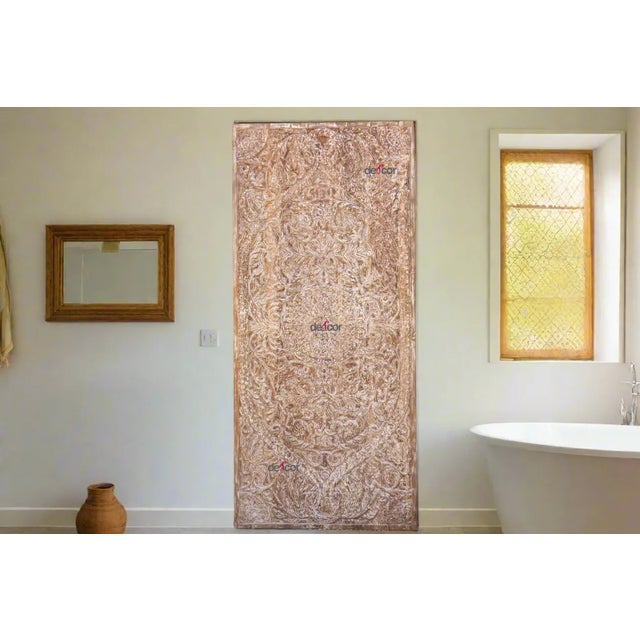 This reclaimed teak door panel is a captivating conversation starter. Hand-carved with meticulous detail, it showcases a...