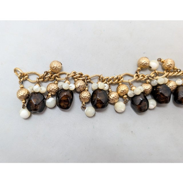 Vintage 1960s Signed Napier Goldtone Faux-Topaz & Mother of Pearl Charm Bracelet For Sale - Image 12 of 14