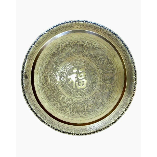 Fabulous folding table with a scalloped brass charger. The brass charger features beautiful etchings inspired by Eastern...