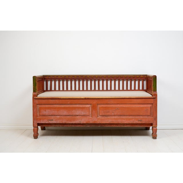 Rare folk art bench or sofa from northern Sweden, unusually well-crafted with decorative panels and sculpted legs. It...