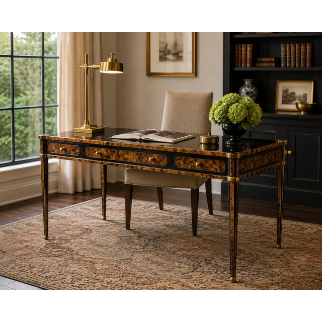 This exquisite desk is finished on all sides, allowing it to make a stunning statement from any angle in a room. It...