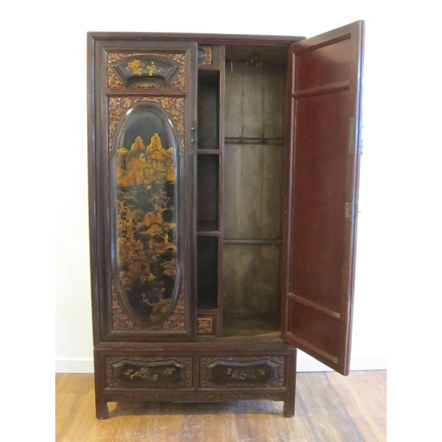 19th century gilt painted wardrobe cabinet. A very special Qing dynasty wedding cabinet elaborately decorated with fine...