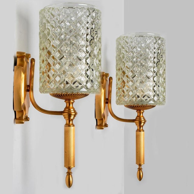 Elegant light fixtures from europe, germany around 1960. The glass shows a beautiful diamond texture, which gives a...