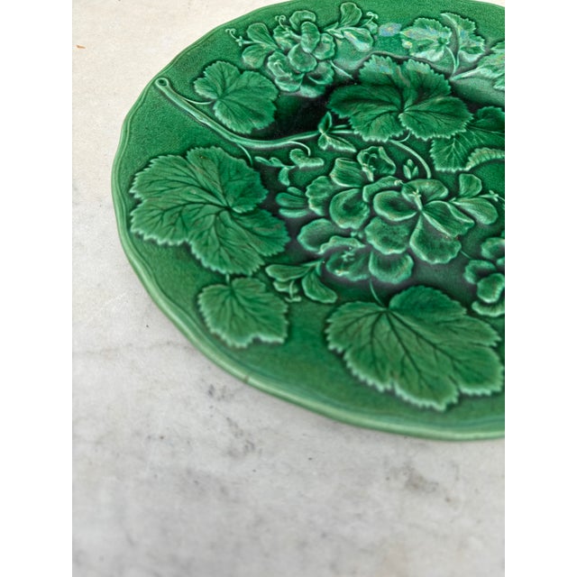 English green Majolica geranium plate, circa 1880. One hairline.