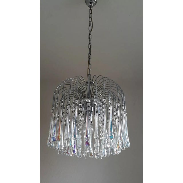 70s waterfall lamp Object: Pendant / ceiling lamp 55 arms 3x E14 1x E24 Age: circa 1970s Color/Material: Silver...