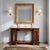 Empire console table in mahogany and mahogany crotch. White marble top supported by two pairs of square columns resting on...