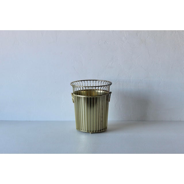 Vintage 1960s Hollywood Regency metal wastebasket Hoop Handles with liner and sphere feet. Hoop Handles are stationary....