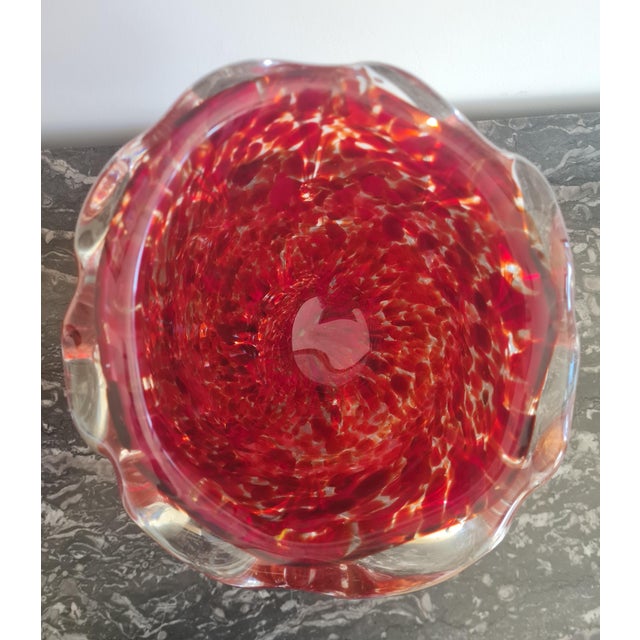A spectacular and highly collectible Mid-Century Murano art glass vase, executed in rich ruby-red “Rubino” glass and...