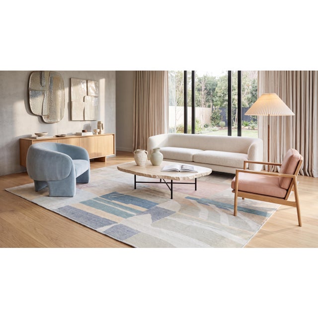 Elevate your space with this exquisite contemporary wool rug, designed as a piece of functional textile art. Featuring a...