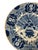 This is a classic piece of Delft. The central motif shows a decorative urn overflowing with flowers and large palm/fern...