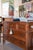 A beautifully crafted French Louis XVI style three-drawer commode, distinguished by elegant fluted pilasters, tapered...