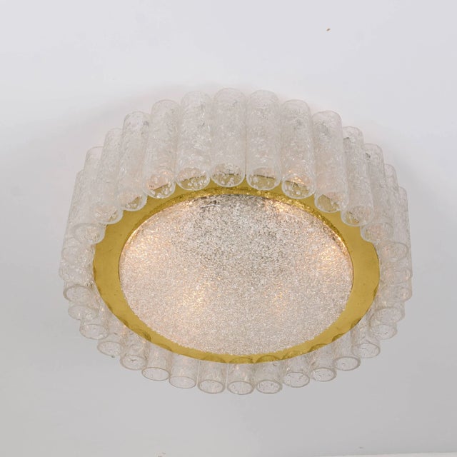 Two Doria flush mount chandeliers, 32 organic glass tubes surrounding a central glass diffuser mounted with minimal...