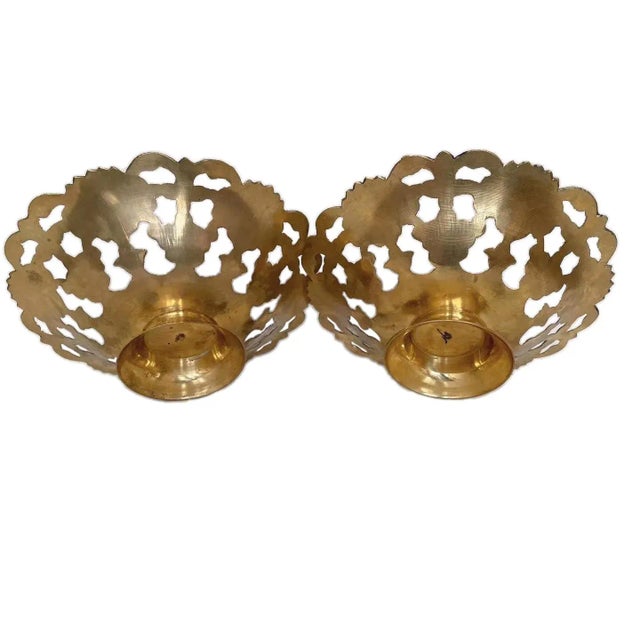 A pair of brass decorative bowls from India with colorful floral enamel pattern. 7.75 inches diameter x 2.5 inches tall.