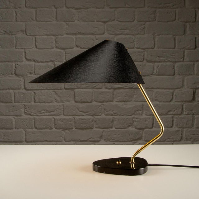 Desk lamp by pgh elektro. Lacquered metal shade, brass arm and black granite base. Germany. 1950s. light will work in...