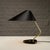 Desk lamp by pgh elektro. Lacquered metal shade, brass arm and black granite base. Germany. 1950s. light will work in...
