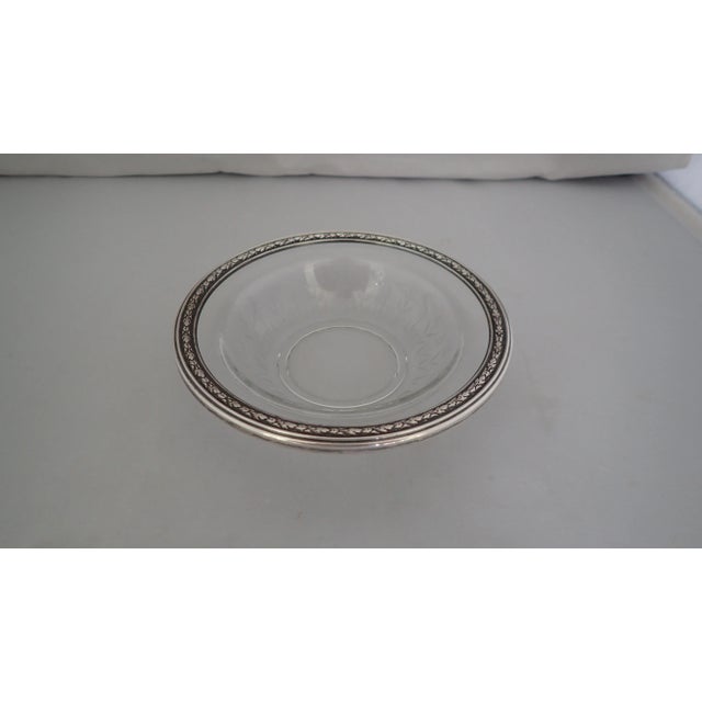 Estate from shoreline CT bowl with a sterling silver rim border and a cut glass center with etched flowers around the...