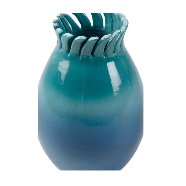 Hand sculpted by master artisans in Italy, this stunning ceramic vase features a blue ombre glaze that is reminiscent of...