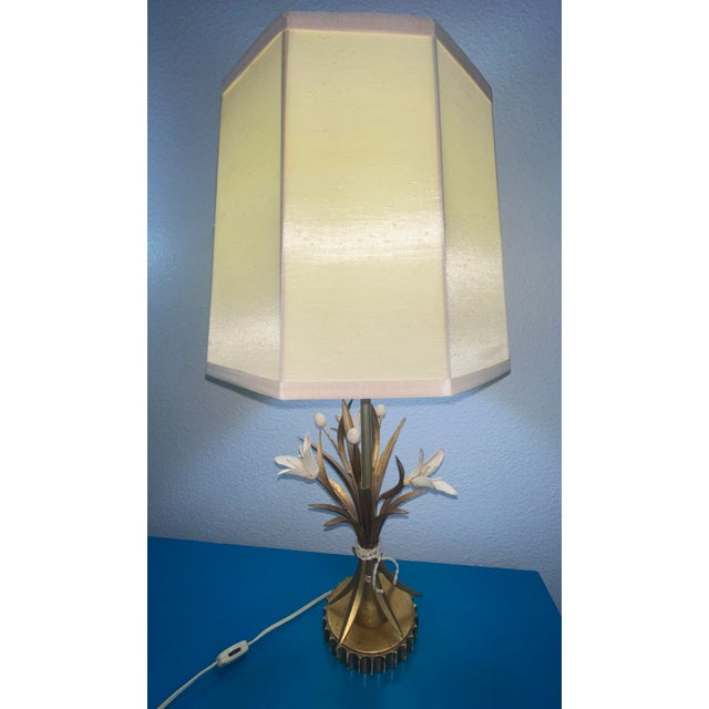 Safran & Glucksman Gilded Italian Hollywood Regency Tole Table Lamp This lamp is gold with beige flowers and flowerbuds,...