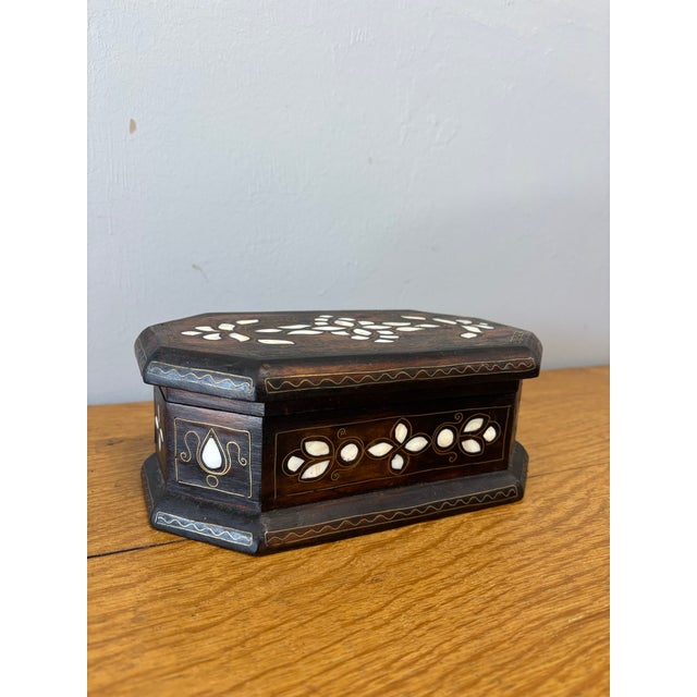 There is something irresistible about a small box — an object made not only to hold treasured things, but often becoming...