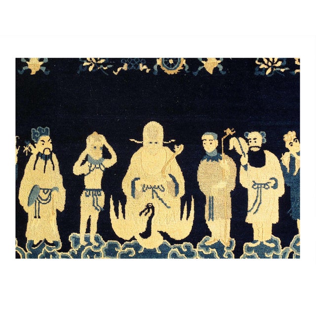 This is a Chinese rug featuring the Immortals (Ba Xian), who are legendary figures in Taoist mythology. D15132