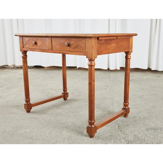 Elegant writing table or desk made on a diminutive scale in the French Louis Philippe taste. The table features an amazing...