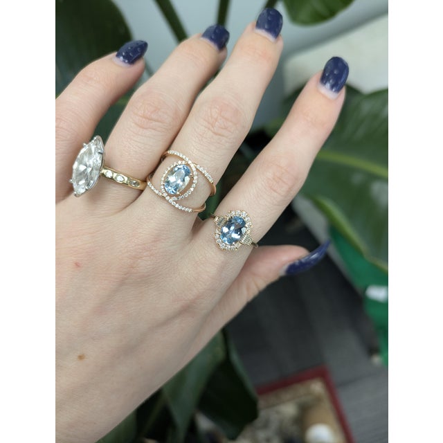 Aquamarine ring with natural diamond accents set in solid 14 K gold — serene ocean hues meet timeless sparkle. 1.5cts of...