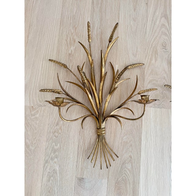A large pair of mid-century Italian "sheaf of wheat" wall sconces, masterfully hand-forged in solid wrought iron. Unlike...