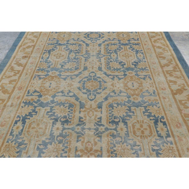 Hand-knotted in wool, this 7’0x14’7” rug exemplifies classical design traditions adapted to a grand scale, from the period...