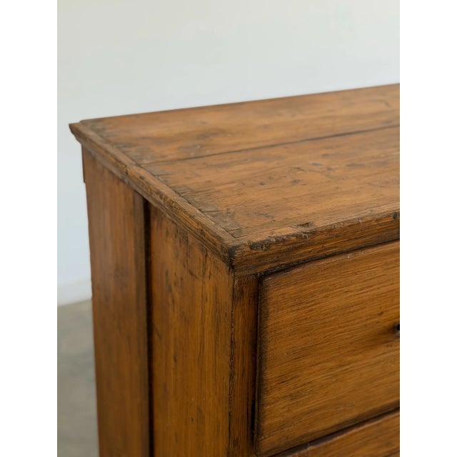 W38.5 D21.5 H40.75 An antique pine cupboard featuring a spacious upper drawer above a pair of paneled cabinet doors,...