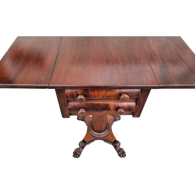 This elegant 19th century Mahogany Empire drop leaf nightstand showcases the timeless appeal of the Empire style. Crafted...