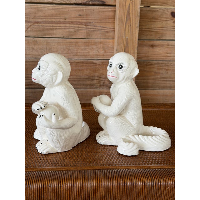 Absolutely charming pair of white porcelain Capuchin monkeys by Chelsea House, full of personality and playful detail....
