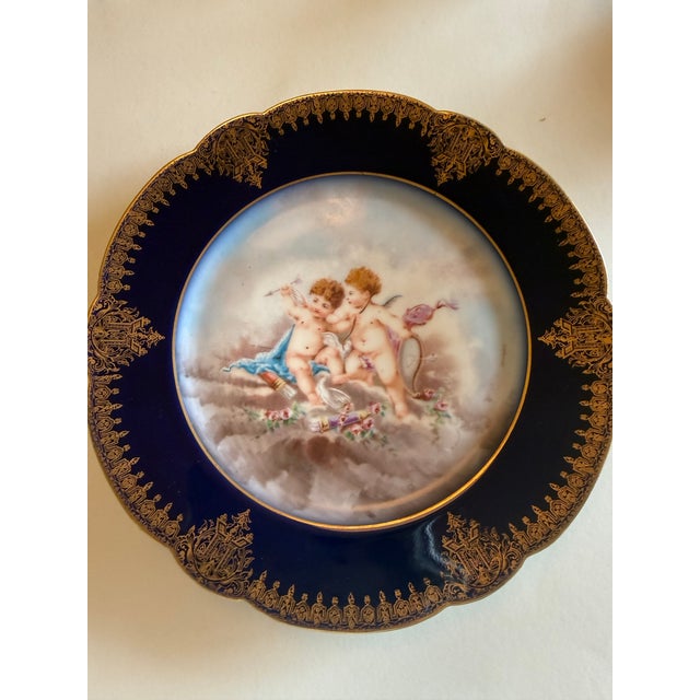 handsome pair of antique French Limoges cabinet plates by Wm. Guerin & Co., dating to the late 19th/early 20th century....